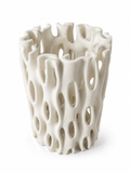 Coral Window Vase, a warm ivory ceramic clay-printed vase with organic window openings on a white background.